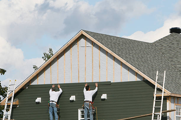 Professional Siding Contractor technician working in Roslindale, MA